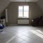 Proměna půdního prostoru na ložnici s použitím laminátové podlahy Quick-Step ze série Impressive