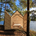 Dřevěná chata se stěnami z plexiskla umožní dokonalé spojení s přírodou Foto: Jeanna Berger